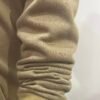 Close-up of sleeve detail on Wearees khaki cotton fleece hoodie.