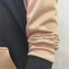 Side arm detail of Wearees black polyester hoodie with stylish Palestine design - quality craftsmanship