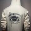 Back view of Wearees white cotton fleece hoodie with inspirational 'Stay Optimistic' graphic.