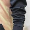 Side arm detail of Wearees black polyester hoodie - quality craftsmanship