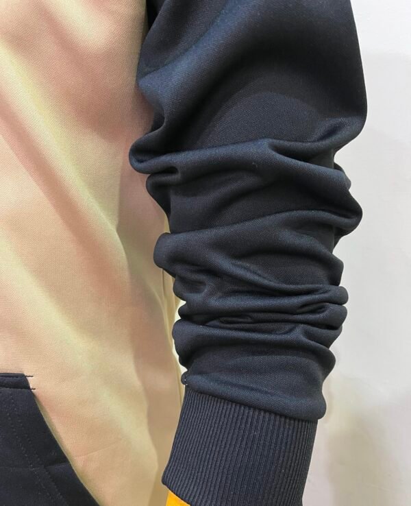 Side arm detail of Wearees black polyester hoodie - quality craftsmanship